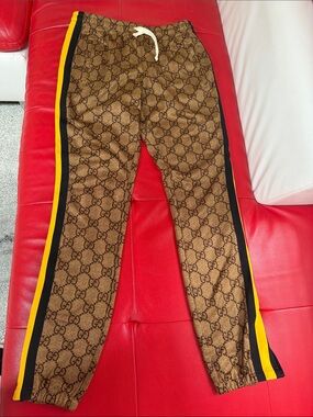 Gucci Brown Monogram Track Pants with Black and Yellow Stripes